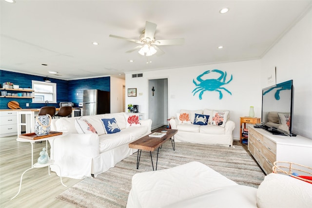 living room featuring ceiling fan and light wood-type flooring