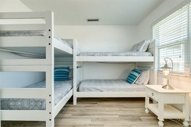 bedroom with hardwood / wood-style floors