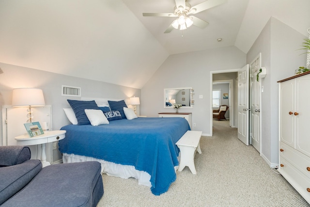 carpeted bedroom with ceiling fan and lofted ceiling