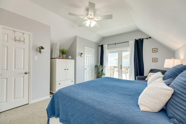 carpeted bedroom with ceiling fan and lofted ceiling