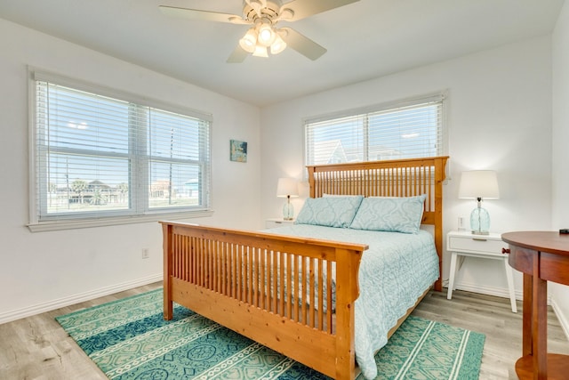 bedroom with hardwood / wood-style flooring and ceiling fan