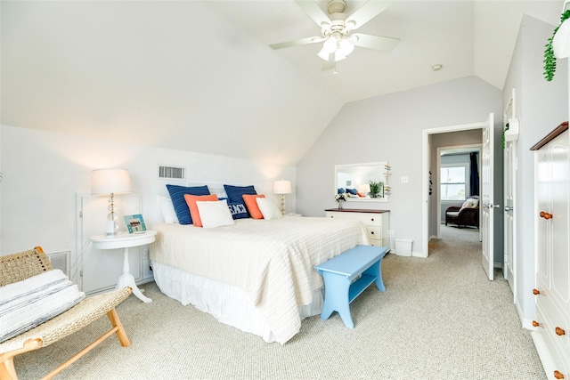 bedroom with light colored carpet, ceiling fan, and lofted ceiling