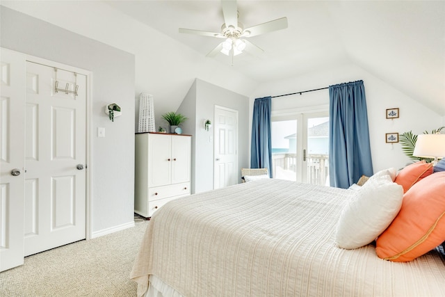 carpeted bedroom featuring access to outside, ceiling fan, and vaulted ceiling