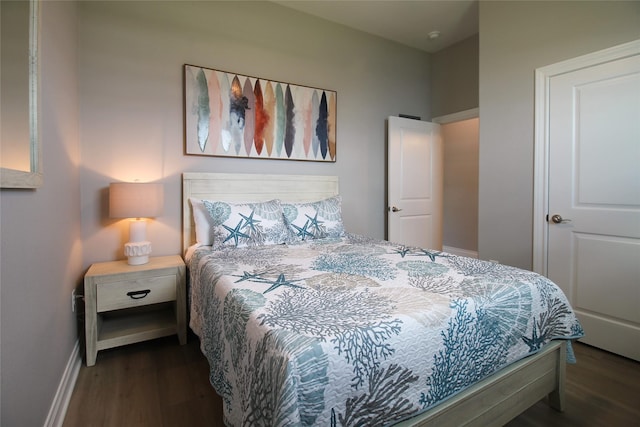 bedroom featuring dark hardwood / wood-style flooring