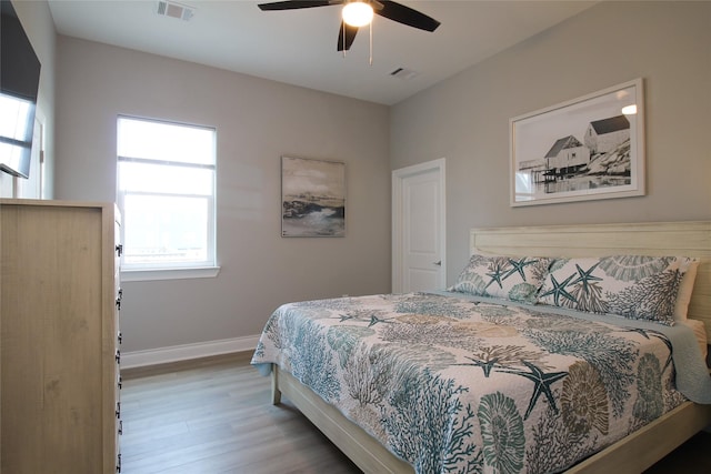 bedroom featuring wood-type flooring and ceiling fan