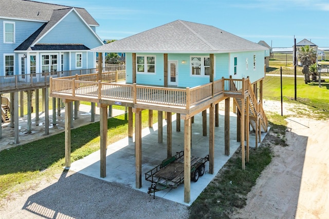 view of jungle gym with a wooden deck and a yard