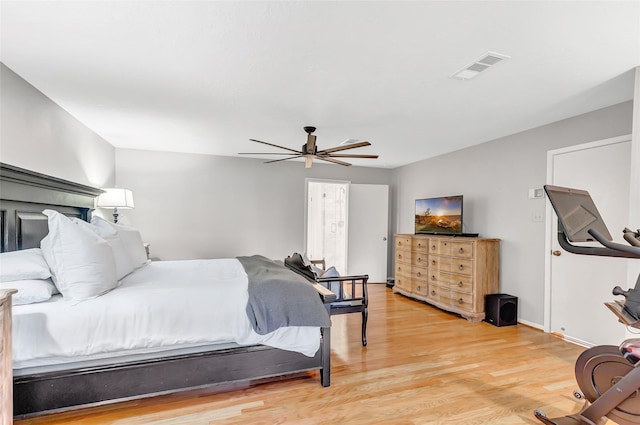 bedroom with visible vents, ceiling fan, light wood-style flooring, and baseboards