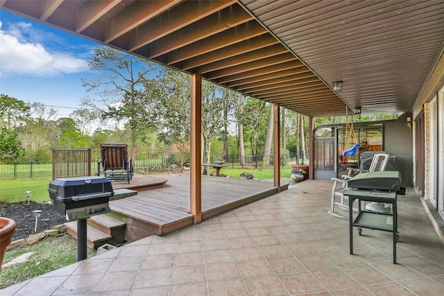 wooden terrace with a patio and fence