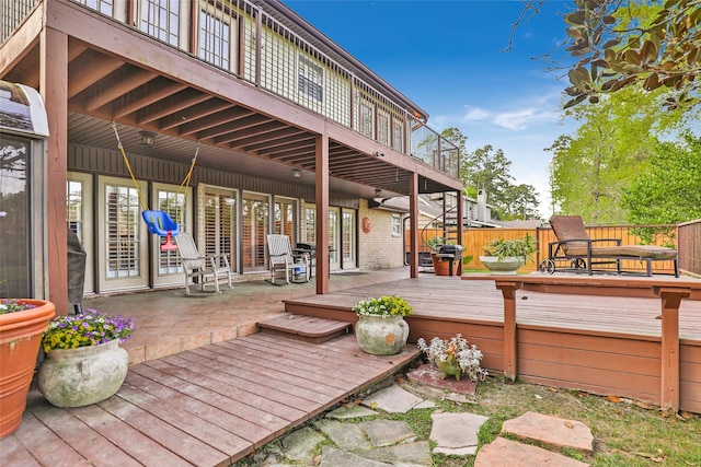 view of patio / terrace with area for grilling, fence, and a wooden deck