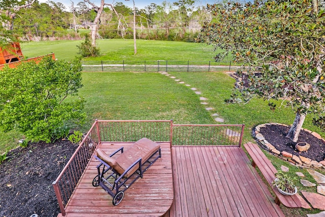 deck with fence and a lawn