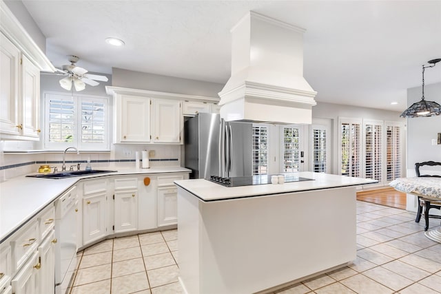 kitchen featuring white cabinetry, dishwasher, a sink, and light tile patterned floors