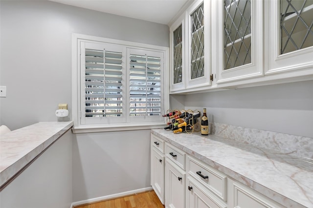 interior space featuring light wood-style flooring and baseboards