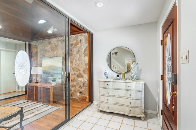 bathroom with tile patterned flooring, vanity, and baseboards