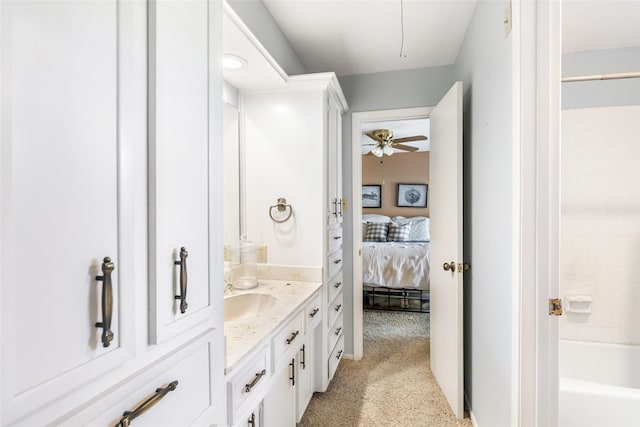 full bath with a ceiling fan, connected bathroom, and vanity