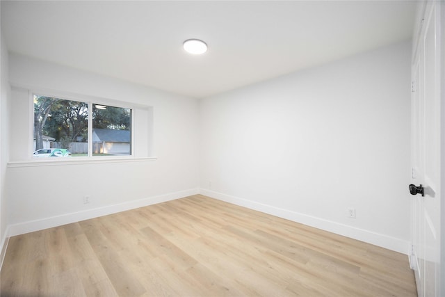 empty room with light hardwood / wood-style floors