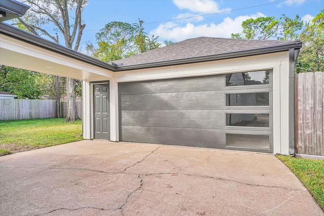 garage featuring a yard