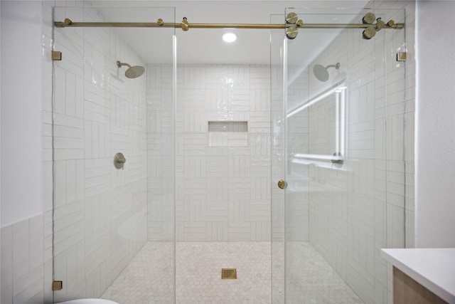 bathroom with a shower with shower door