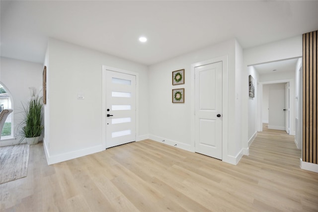 entryway with light hardwood / wood-style floors