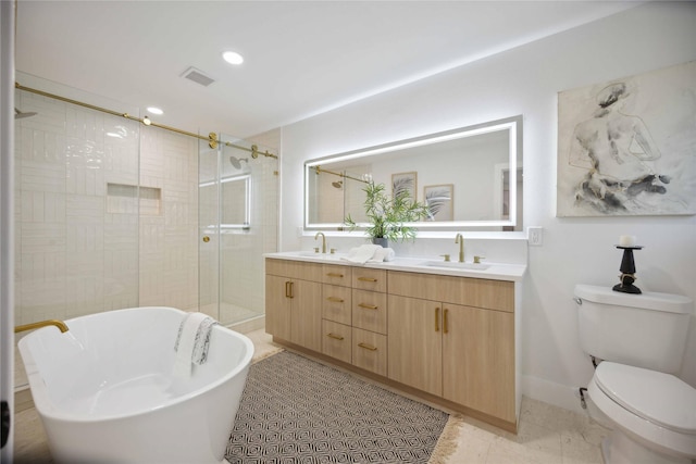 full bathroom featuring tile patterned flooring, toilet, vanity, and shower with separate bathtub