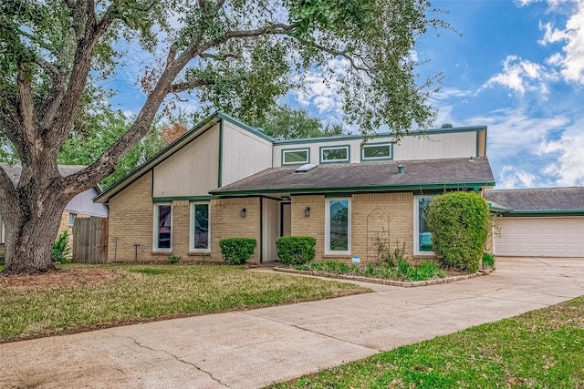 view of front of home featuring a front lawn and a garage