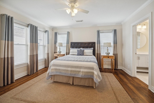 bedroom featuring connected bathroom, ceiling fan, dark hardwood / wood-style floors, and ornamental molding