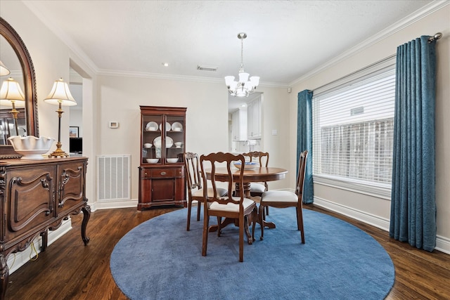 dining room with a notable chandelier, dark hardwood / wood-style floors, and ornamental molding