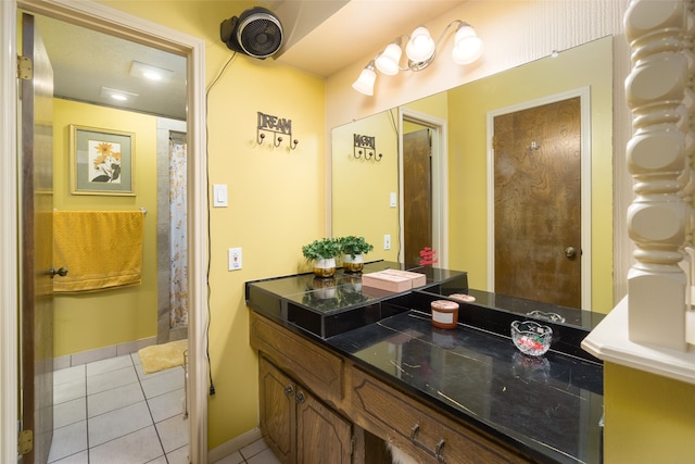 bathroom featuring tile patterned flooring and vanity