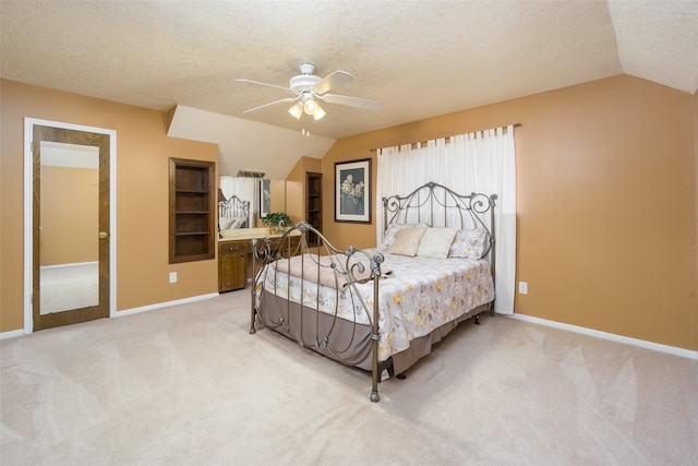 carpeted bedroom featuring ceiling fan, lofted ceiling, and a textured ceiling