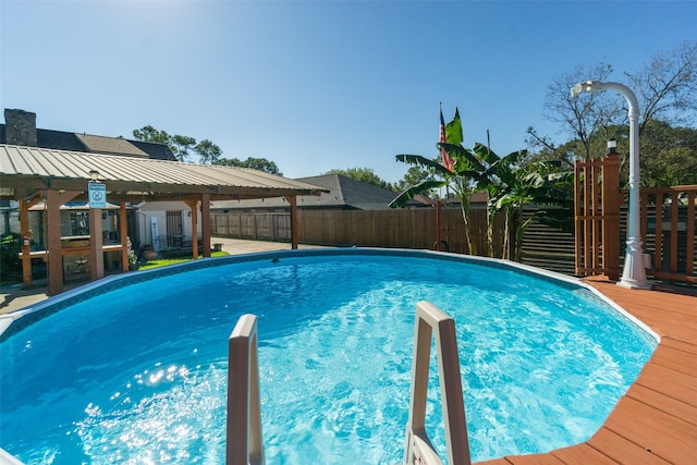 view of swimming pool featuring a deck