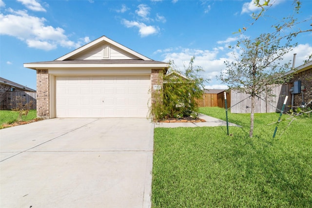 view of front of home featuring a front yard and a garage