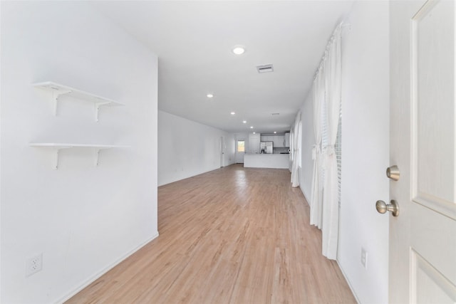 unfurnished living room with light wood-type flooring