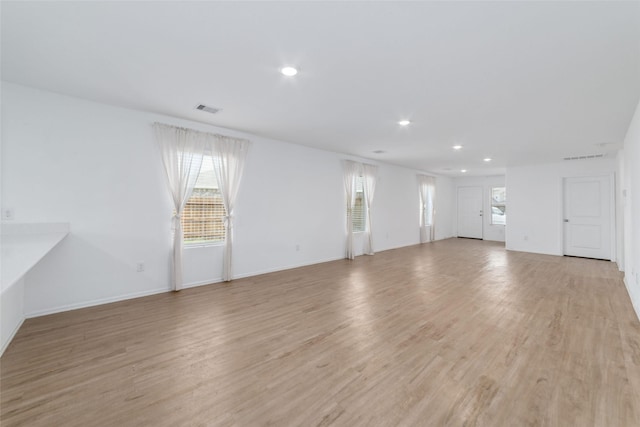 unfurnished living room featuring light hardwood / wood-style flooring