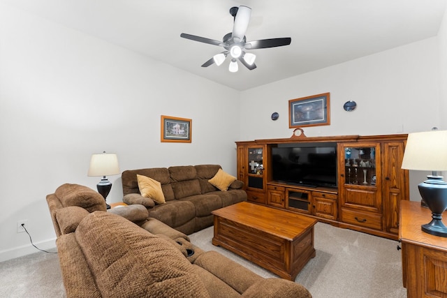 carpeted living room with ceiling fan