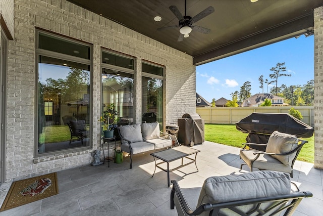 view of patio with outdoor lounge area, ceiling fan, and area for grilling