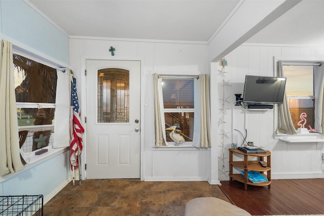 interior space featuring dark hardwood / wood-style flooring and ornamental molding