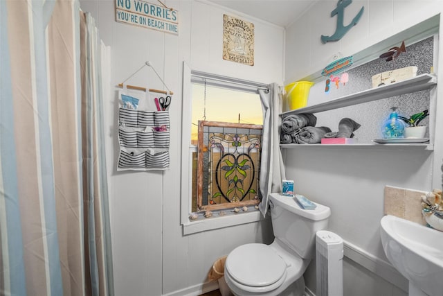 bathroom featuring toilet and sink