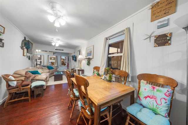 dining room with dark hardwood / wood-style floors and ceiling fan