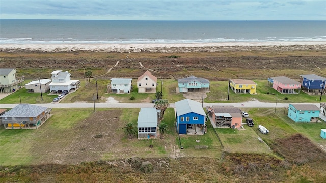 bird's eye view with a water view and a view of the beach