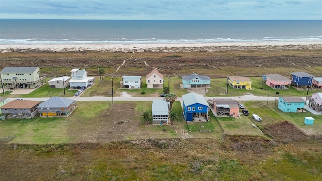 bird's eye view featuring a beach view and a water view