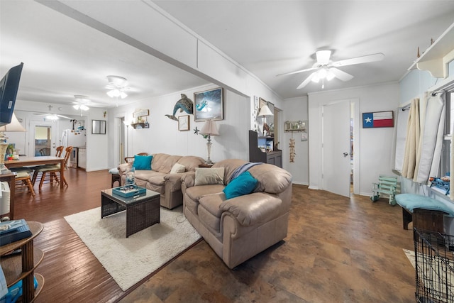 living room featuring ceiling fan and ornamental molding