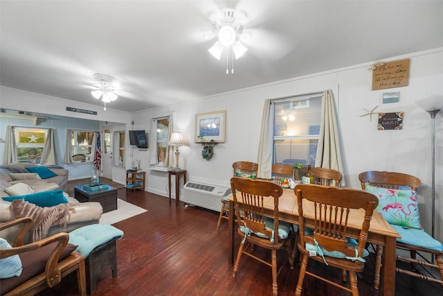 dining space featuring ceiling fan, dark hardwood / wood-style floors, and crown molding