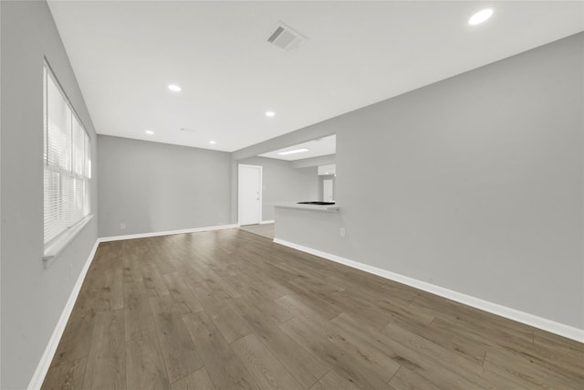 unfurnished living room featuring hardwood / wood-style floors