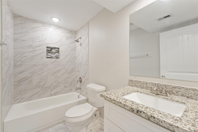 full bathroom with vanity, toilet, and tiled shower / bath