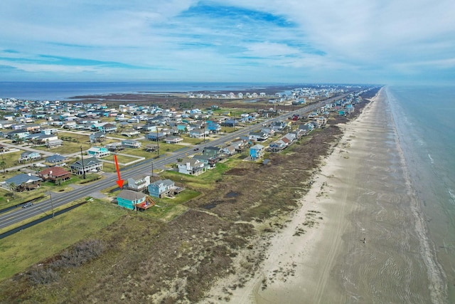 birds eye view of property featuring a view of the beach and a water view