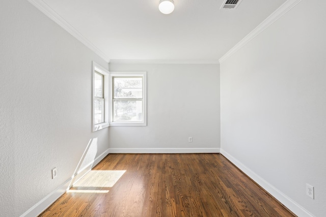 unfurnished room featuring dark hardwood / wood-style floors and ornamental molding