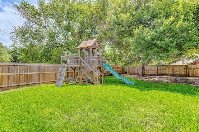 view of playground with a lawn