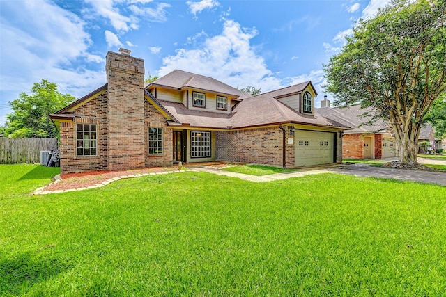 view of front of house with a garage and a front lawn