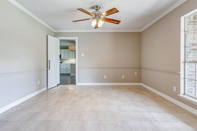 unfurnished room with ceiling fan and crown molding