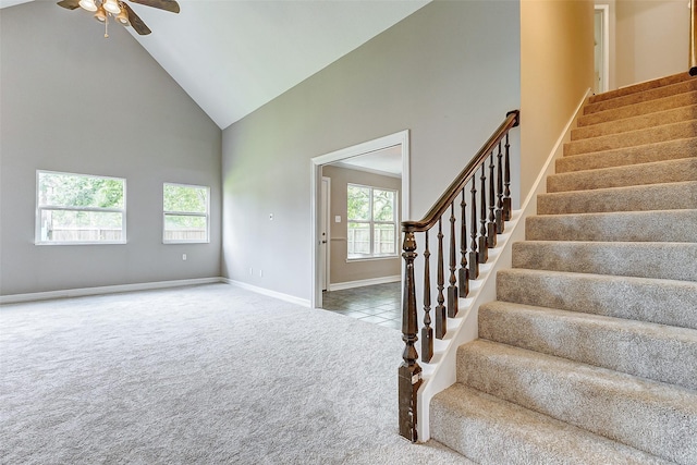 interior space with plenty of natural light, ceiling fan, and high vaulted ceiling