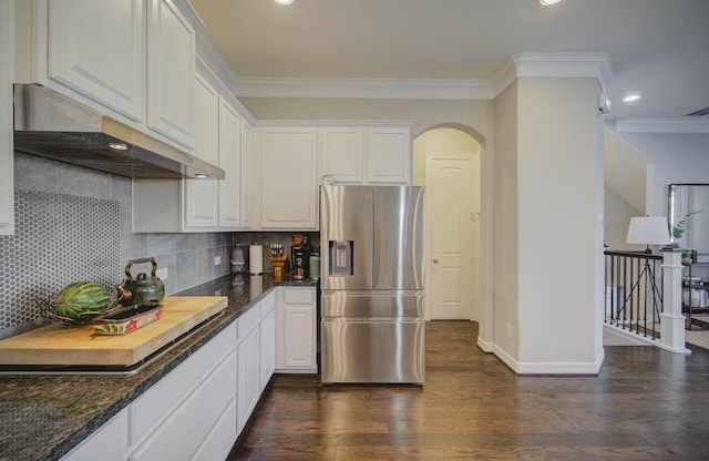 kitchen featuring white cabinetry, dark wood-type flooring, stainless steel fridge with ice dispenser, decorative backsplash, and ornamental molding